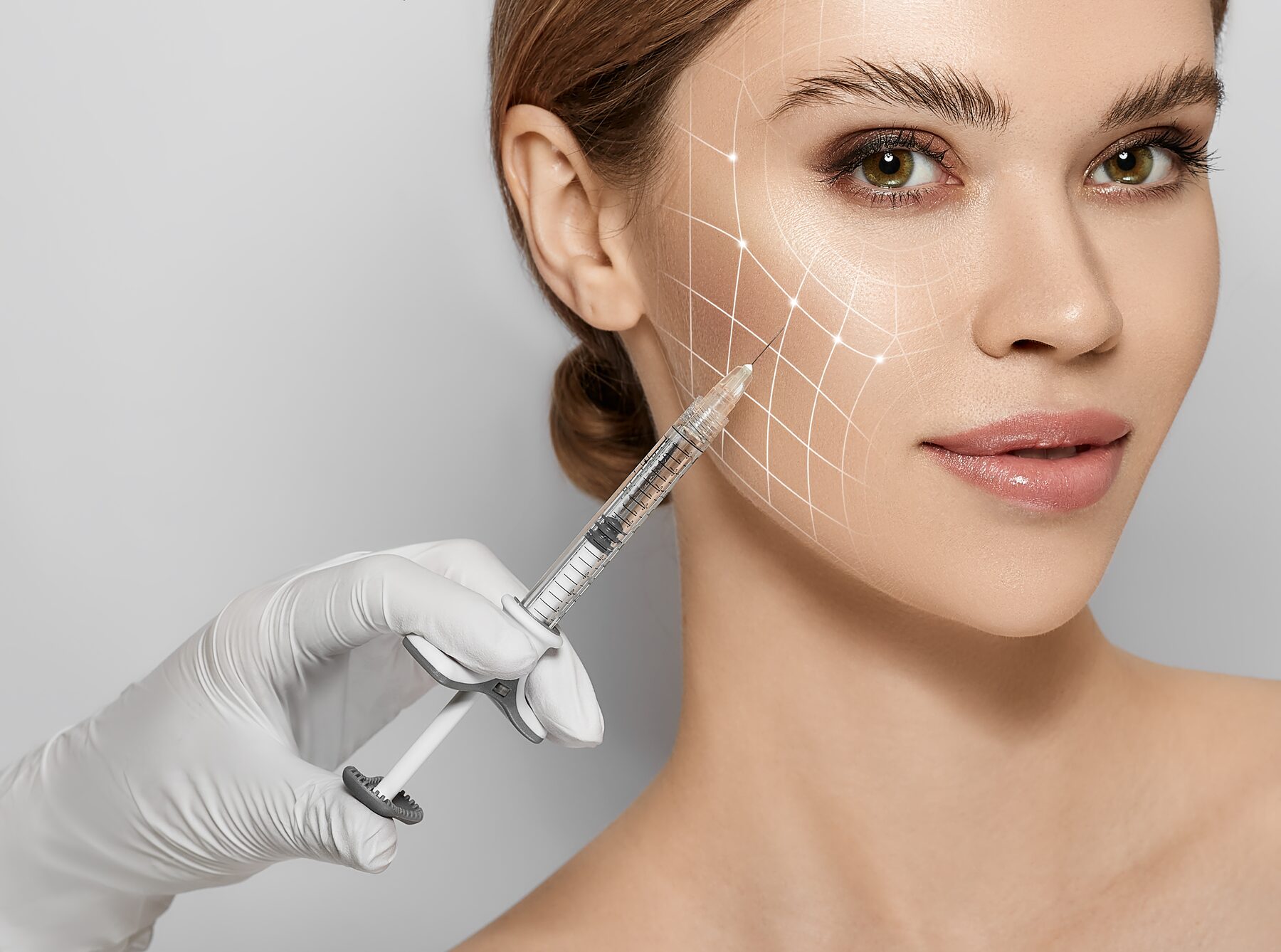 Close-up of a precise neuromodulator injection being performed by a nurse practitioner at Pulse Health & Wellness
