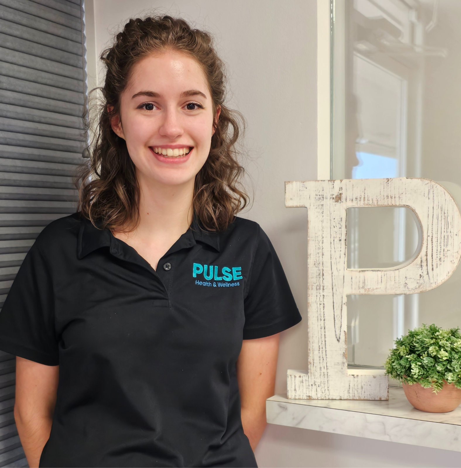 Kinzie, Receptionist at Pulse Health & Wellness